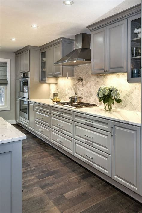 grey cabinets with cisland cook top steel knobs|light grey kitchen cabinets.